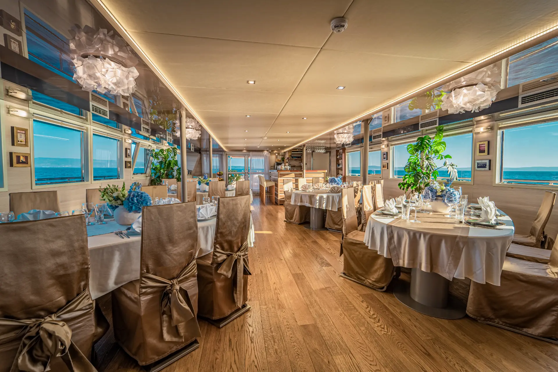 Riva’s elegant salon features sophisticated dining tables, offering a refined space for enjoying gourmet meals in luxurious surroundings.