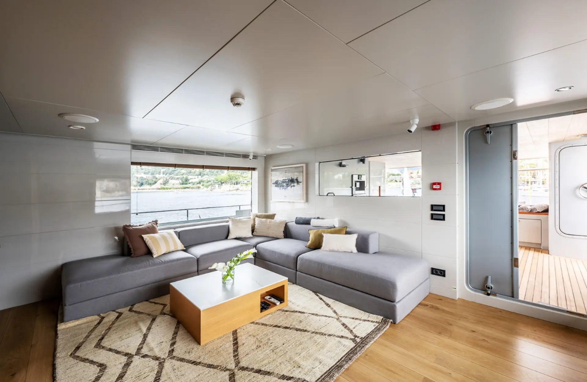 Caladan spacious salon with soft-colored furnishings and entrance view.