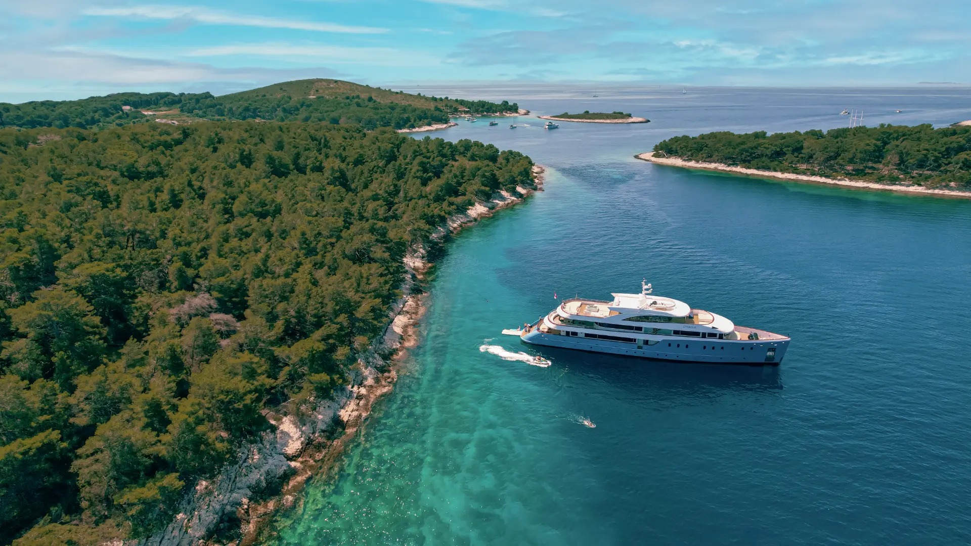 Luxury mini cruiser Ohana - side view from above, peacefully anchored at scenic Pakleni Islands