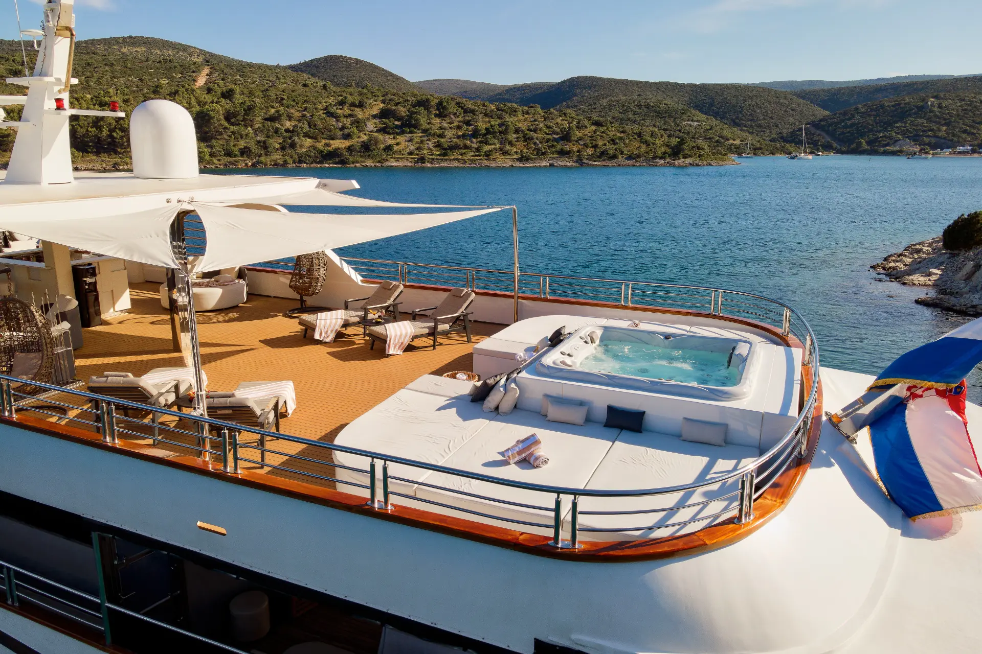 Cristal - aerial shot of spacious sundeck with jacuzzi and sunbathing area