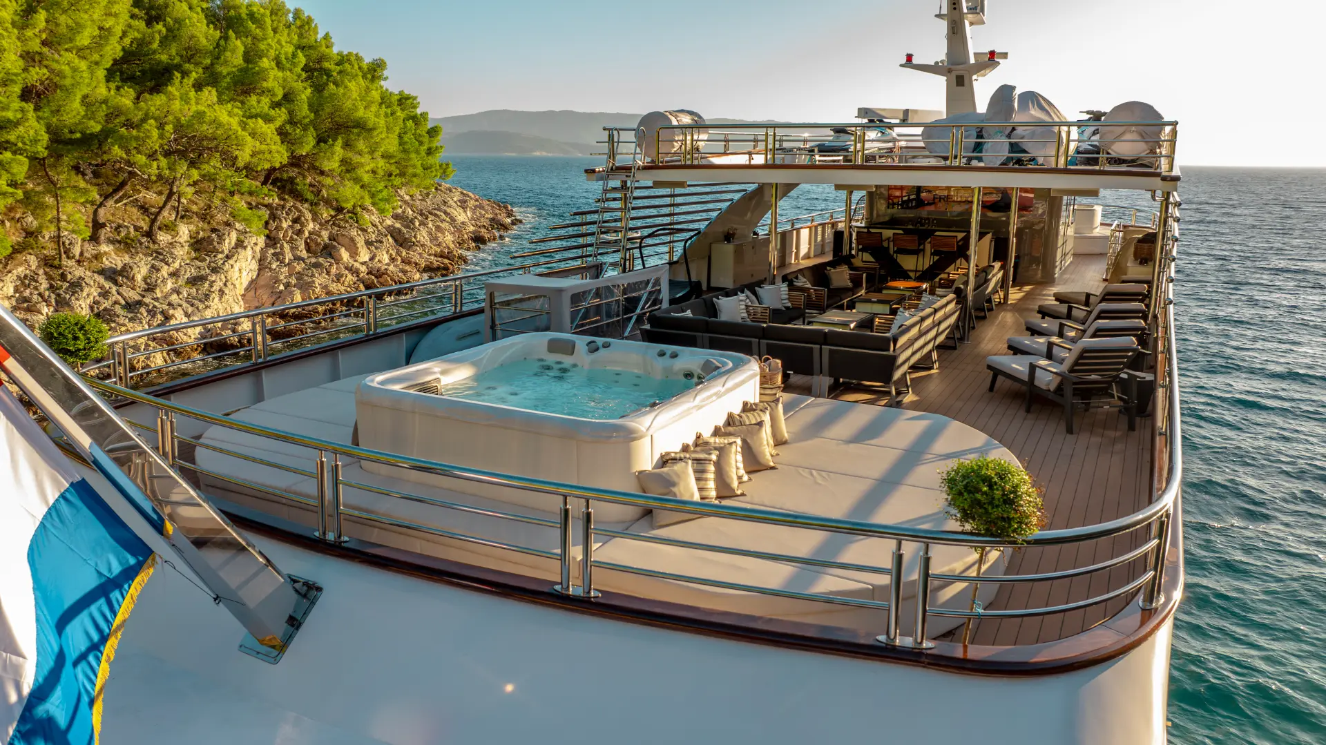 Freedom – aft close view of jacuzzi, sunbathing and lounge area on aft sundeck
