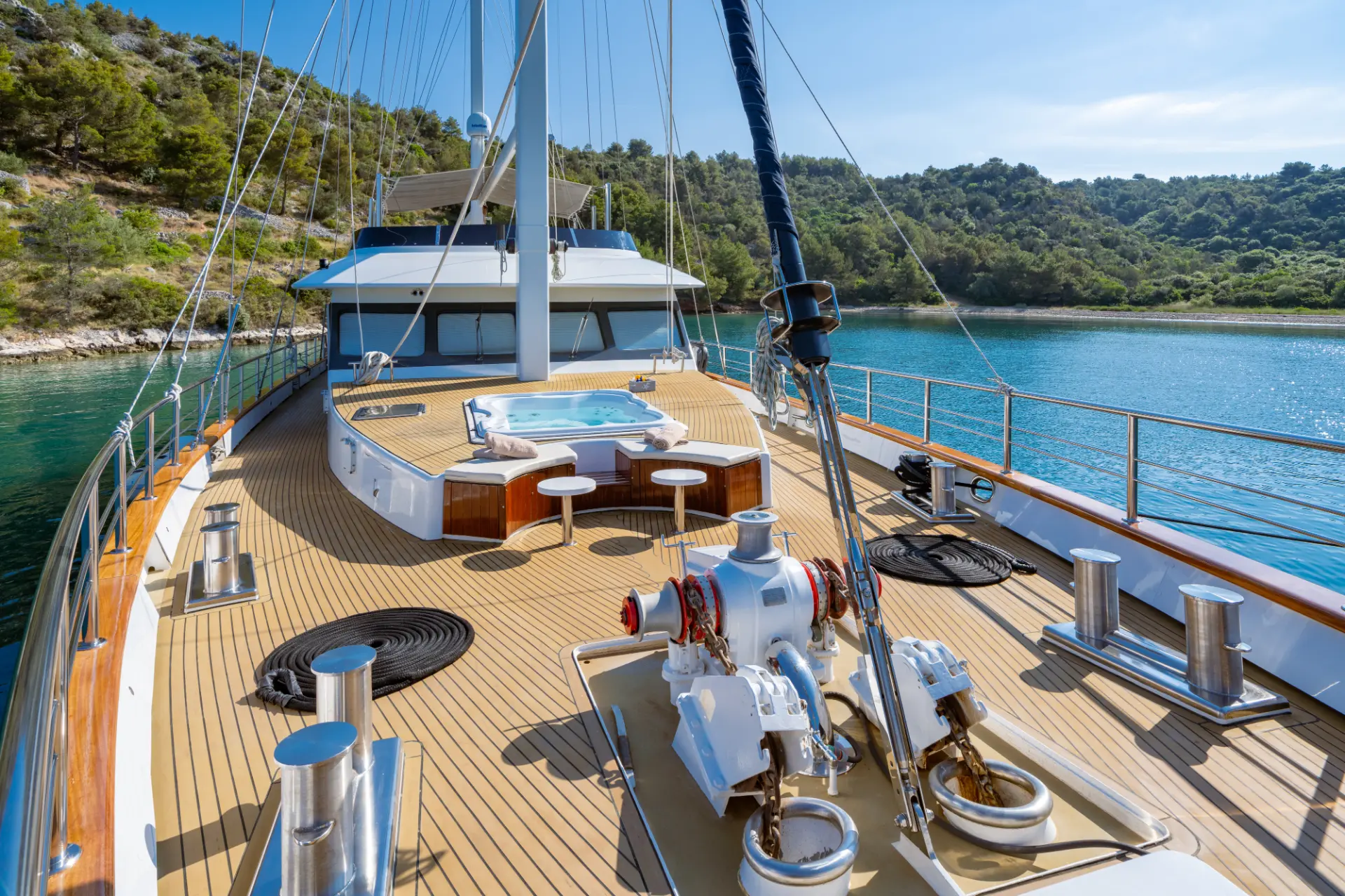 Navilux: foredeck view towards the stern showing teak deck and jacuzzi.