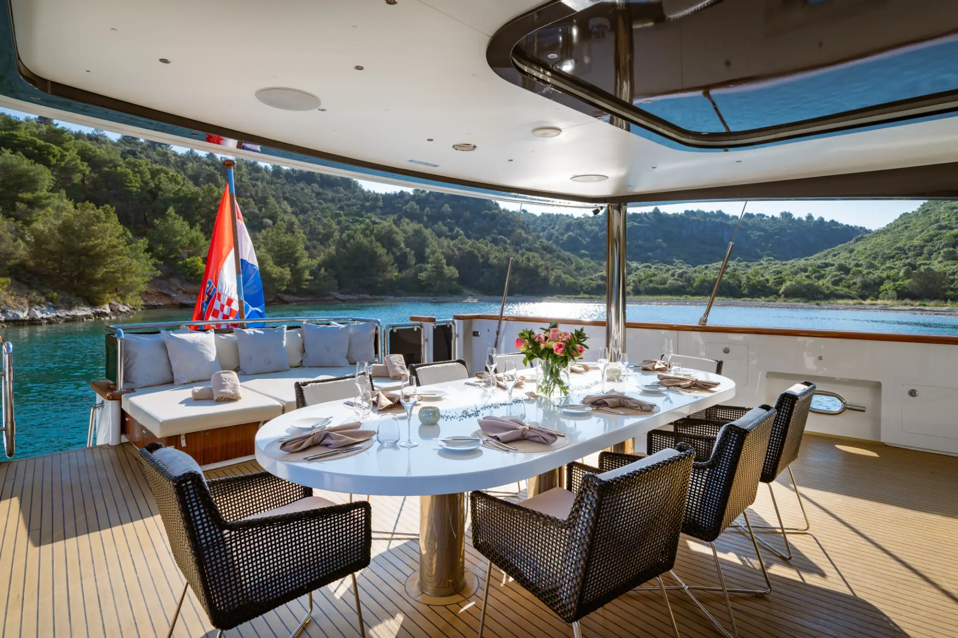 Navilux: looking into aft dining area with comfortable seating.