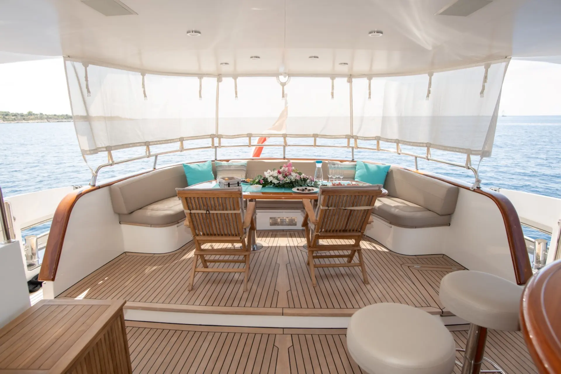 Sea Breeze II – aft cockpit dining setup, view towards stern and yacht’s swim platform