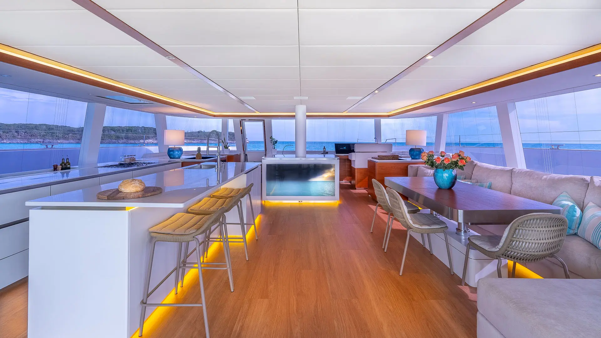 Sunreef 80 'Fantastic Too' - bright salon towards bow, showing dining area, bar, large panoramic windows.