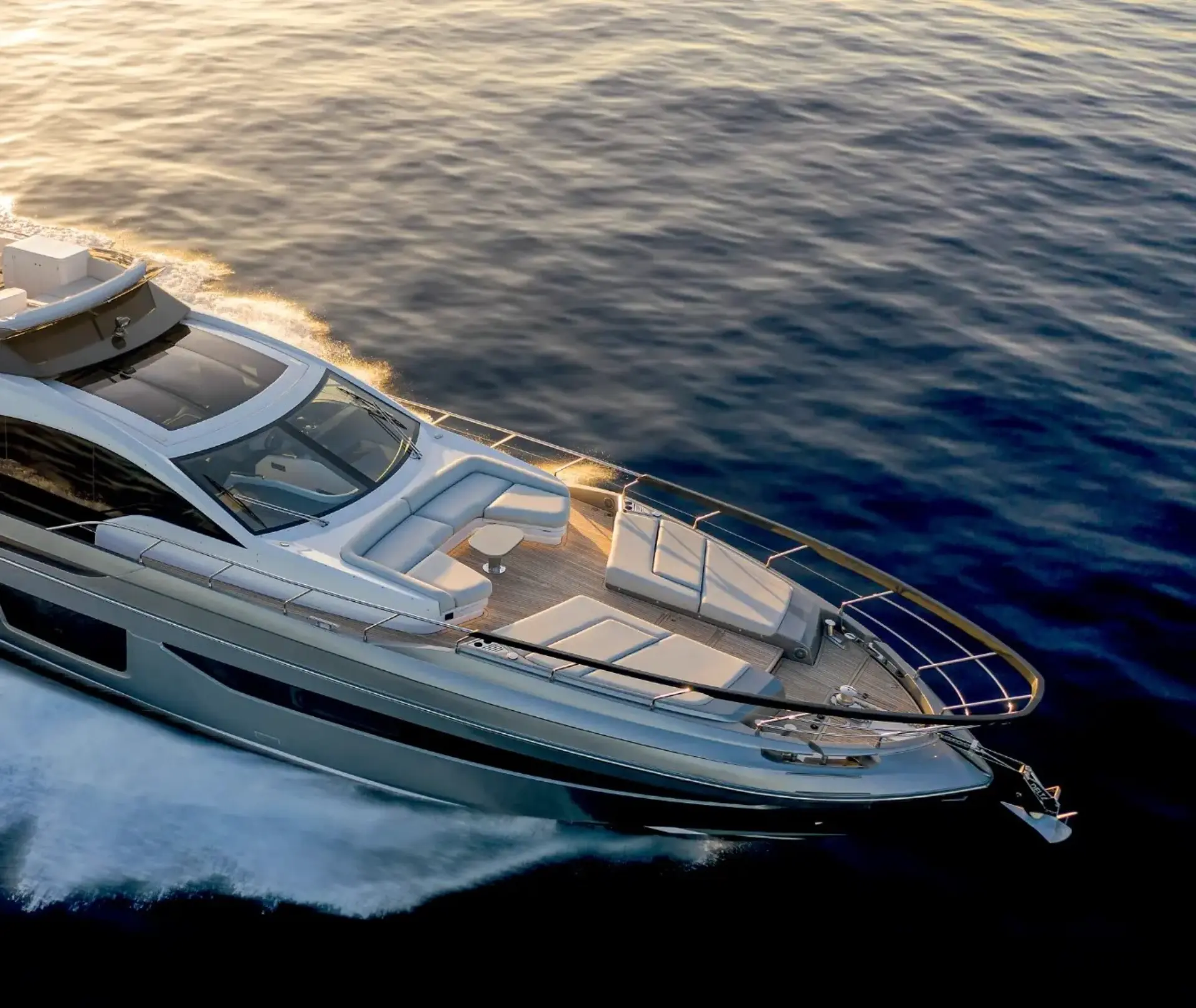 Luxury Motor Yacht Myne – running at sunset, front side view showcasing sleek Azimut S8 design and elegance on the sea.