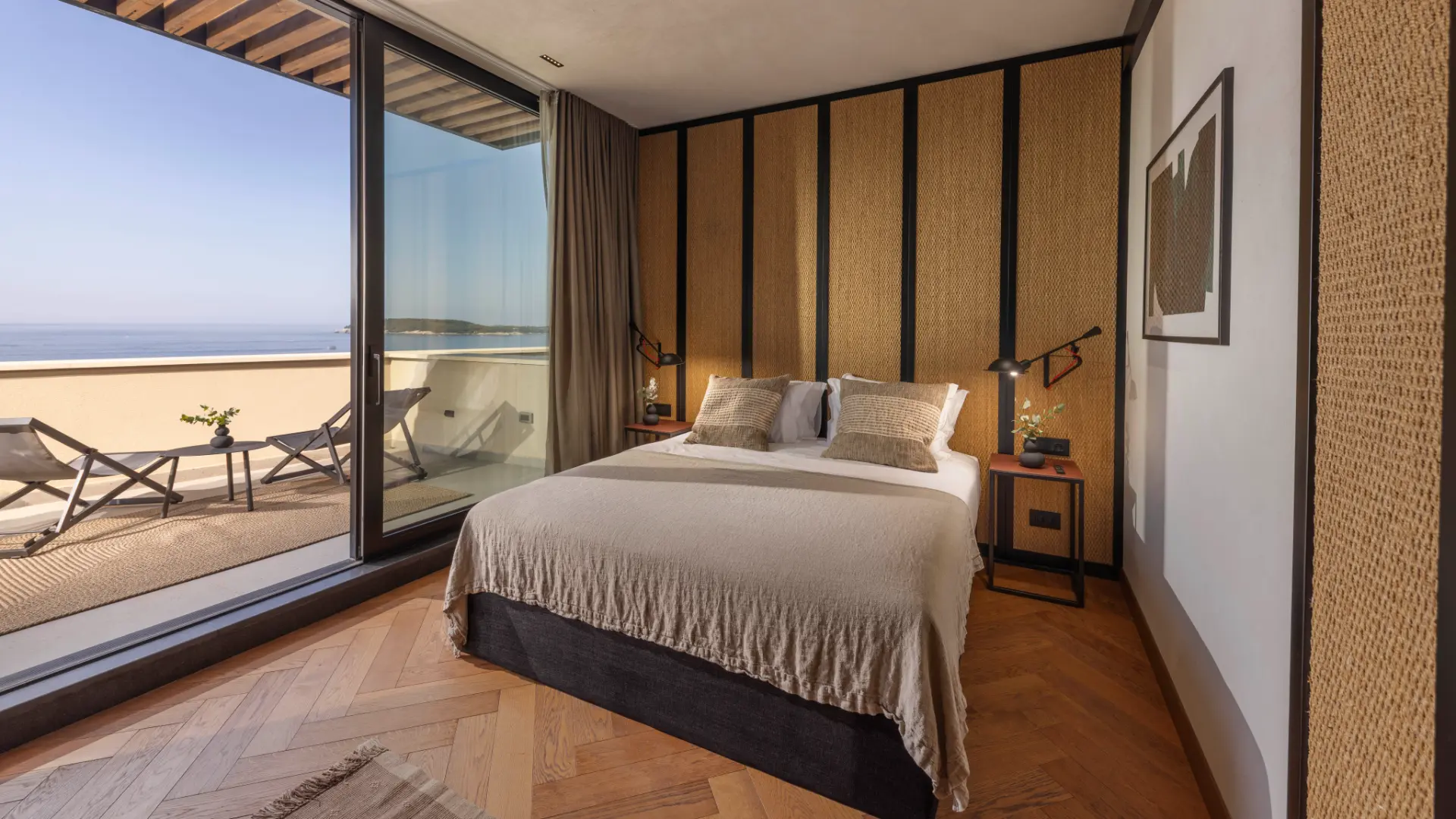 Villa Aurea - cozy double bedroom in warm brown interior, left-side terrace with seating and Adriatic Sea view